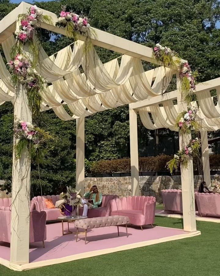 Pink outdoor seating area under canopy